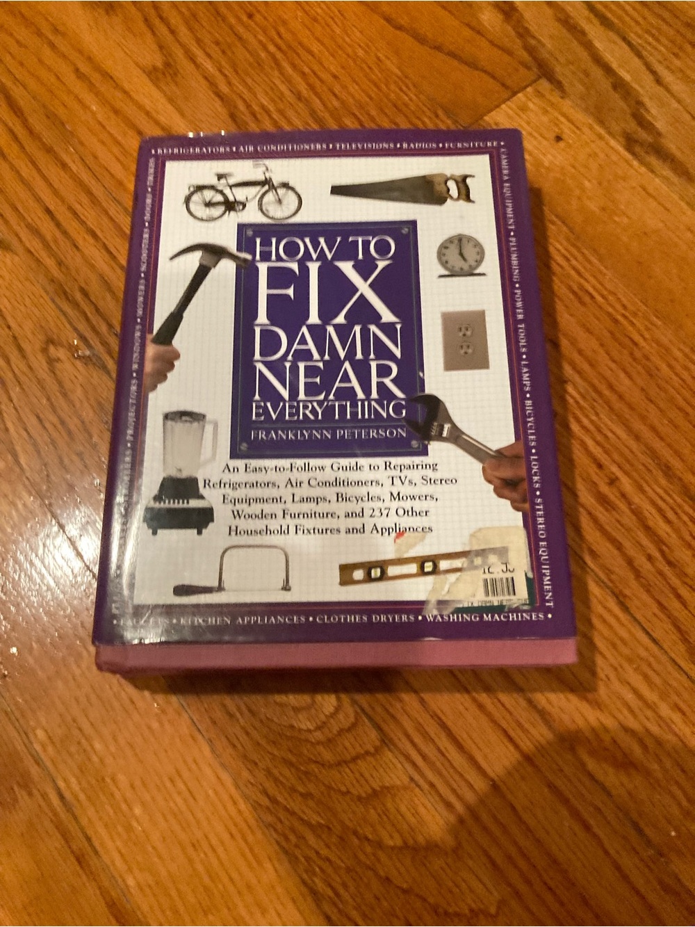How to Fix Damn Near Everything Hardcover Book — Purple & White Cover
